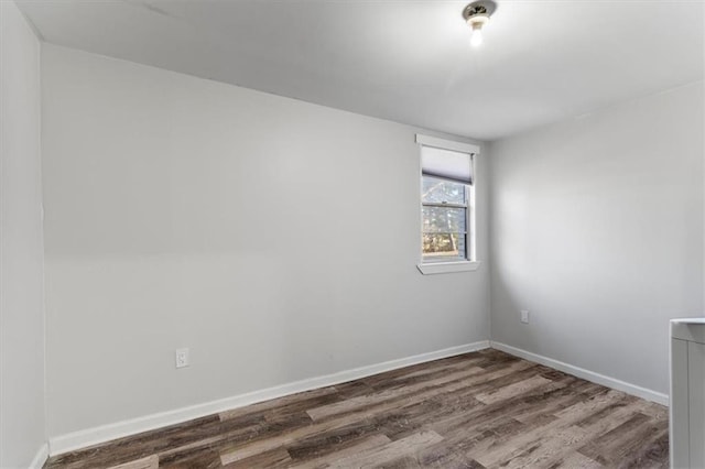 empty room featuring dark hardwood / wood-style floors