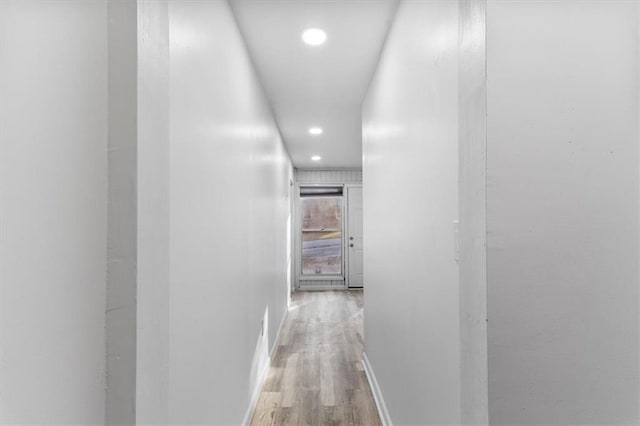 corridor with light wood-type flooring