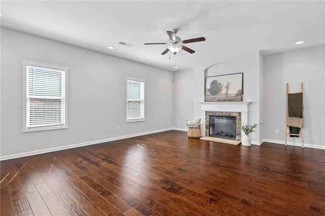 306 Springwater Way, Bremen, GA 30110 - unfurnished living room with a stone fireplace, ceiling fan, recessed lighting, and wood finished floors