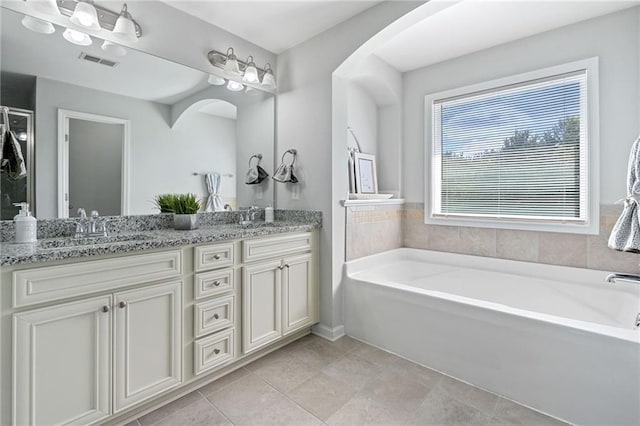 306 Springwater Way, Bremen, GA 30110 - full bathroom featuring double vanity, a garden tub, and tile patterned floors
