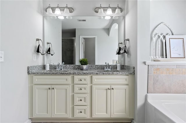 306 Springwater Way, Bremen, GA 30110 - full bath with double vanity, a garden tub, and a stall shower