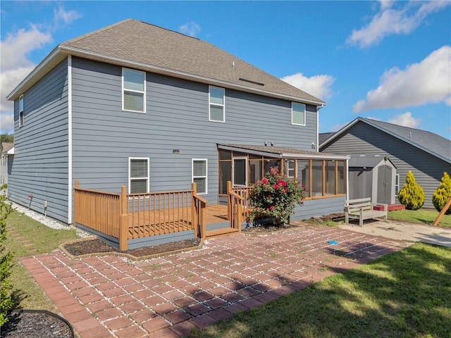 306 Springwater Way, Bremen, GA 30110 - rear view of house featuring a sunroom, a patio, a storage shed, a deck, and a lawn