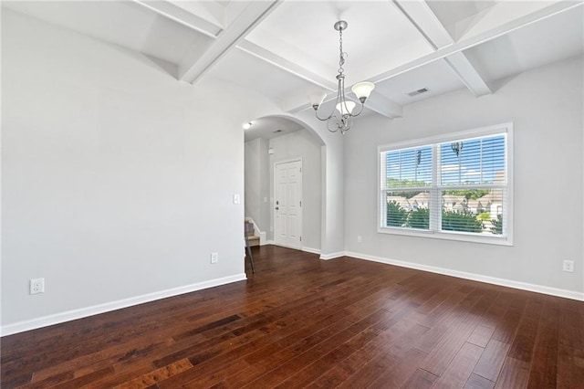306 Springwater Way, Bremen, GA 30110 - empty room featuring arched walkways, dark wood-style flooring, coffered ceiling, a chandelier, and beam ceiling