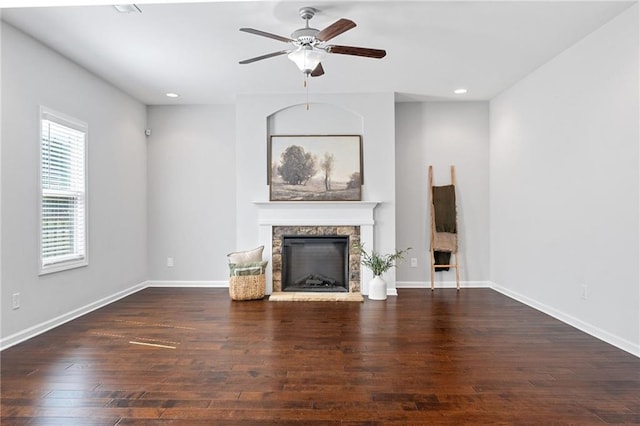 306 Springwater Way, Bremen, GA 30110 - unfurnished living room with a fireplace with raised hearth, wood finished floors, ceiling fan, and recessed lighting