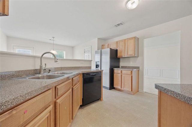 kitchen featuring dishwasher, a sink, stainless steel fridge with ice dispenser, and light brown cabinetry