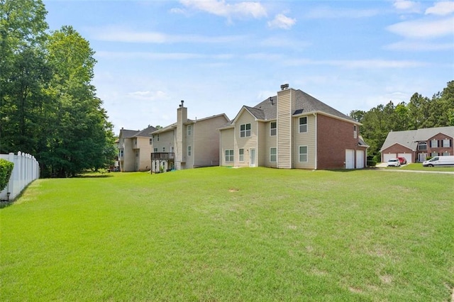 rear view of property featuring an attached garage and a residential view