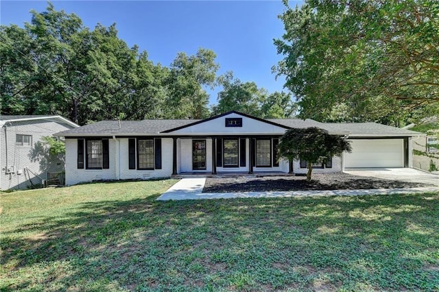 ranch-style house with a front yard and a garage