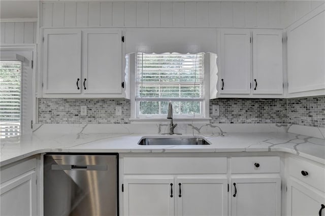 kitchen featuring sink, dishwasher, white cabinetry, and a healthy amount of sunlight