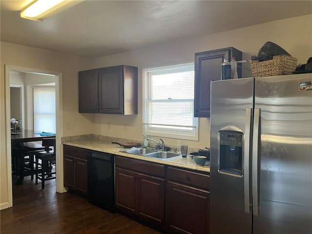 kitchen with a sink, black dishwasher, stainless steel refrigerator with ice dispenser, and light countertops