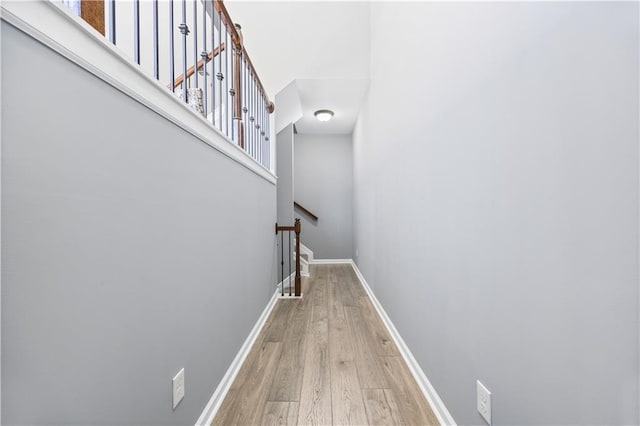 stairs featuring hardwood / wood-style floors