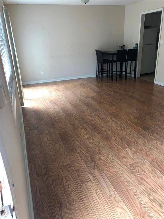 1151 Rankin St Unit 21A, Stone Mountain, GA 30083 - empty room with wood finished floors and baseboards