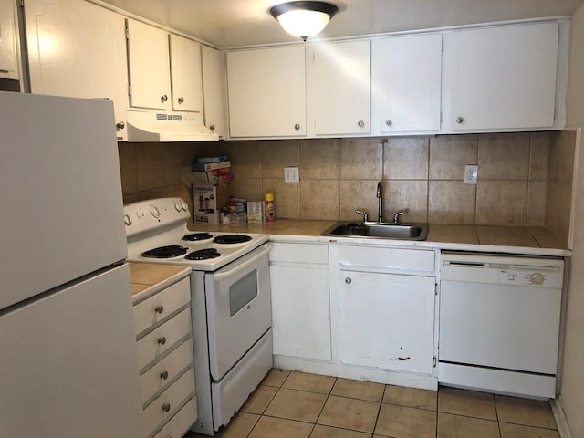 1151 Rankin St Unit 21A, Stone Mountain, GA 30083 - kitchen featuring white appliances, under cabinet range hood, a sink, white cabinetry, and light tile patterned flooring