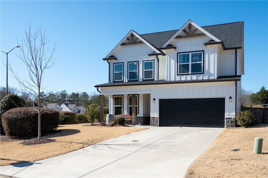 craftsman-style house featuring a garage and central AC