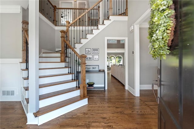 2510 Wood Creek Ct, Dacula, GA 30019 - entryway featuring a towering ceiling, stairway, dark wood-type flooring, baseboards, and ornamental molding