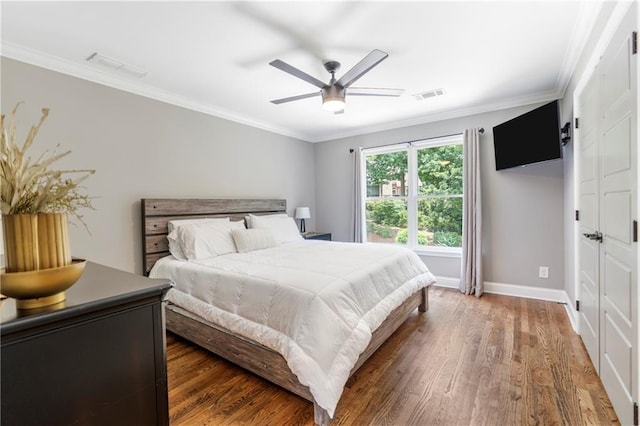 2510 Wood Creek Ct, Dacula, GA 30019 - bedroom with wood finished floors, baseboards, ornamental molding, and a ceiling fan