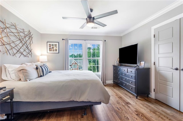 2510 Wood Creek Ct, Dacula, GA 30019 - bedroom featuring ornamental molding, wood finished floors, a ceiling fan, and baseboards