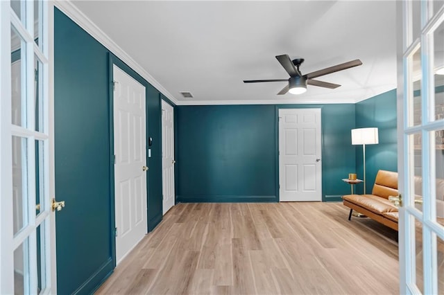 2510 Wood Creek Ct, Dacula, GA 30019 - unfurnished room with light wood-style flooring, a ceiling fan, baseboards, and ornamental molding