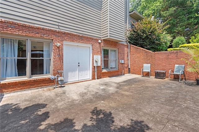 2510 Wood Creek Ct, Dacula, GA 30019 - doorway to property with a patio area and brick siding