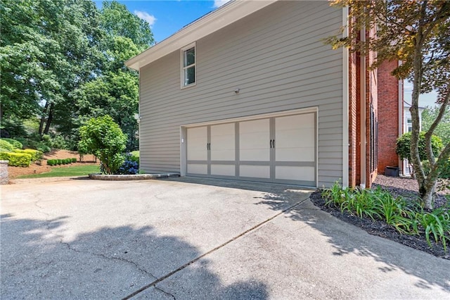 2510 Wood Creek Ct, Dacula, GA 30019 - view of property exterior featuring an attached garage and driveway