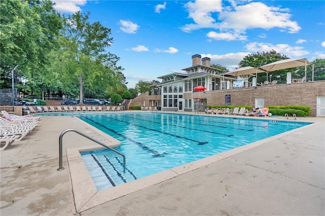 2510 Wood Creek Ct, Dacula, GA 30019 - community pool featuring a patio area