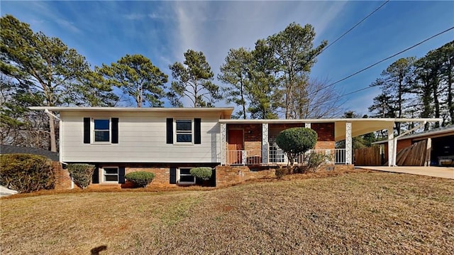 split level home featuring a front yard and a carport