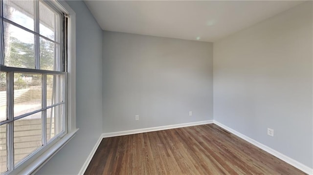 unfurnished room featuring dark hardwood / wood-style floors