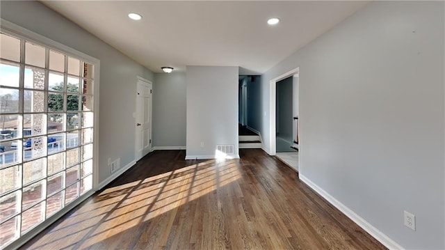 unfurnished room with dark hardwood / wood-style floors