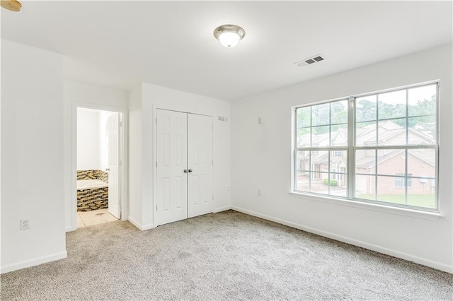 2520 Laurel Cir NW, Atlanta, GA 30311 - unfurnished bedroom with carpet floors, baseboards, a closet, and connected bathroom