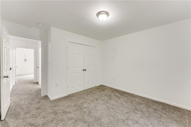 2520 Laurel Cir NW, Atlanta, GA 30311 - unfurnished bedroom with carpet, a closet, and baseboards