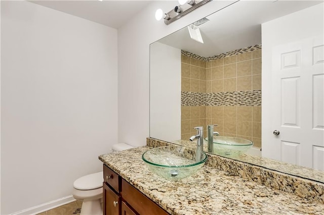 2520 Laurel Cir NW, Atlanta, GA 30311 - bathroom with toilet, vanity, a shower, tile patterned flooring, and baseboards