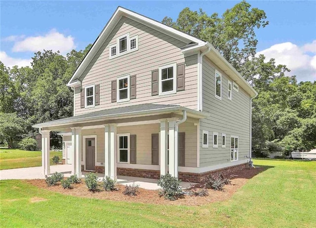 front of property with a porch and a front lawn