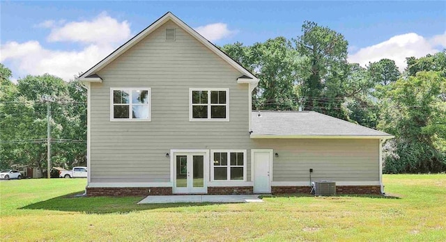 back of house with french doors, central AC, and a lawn