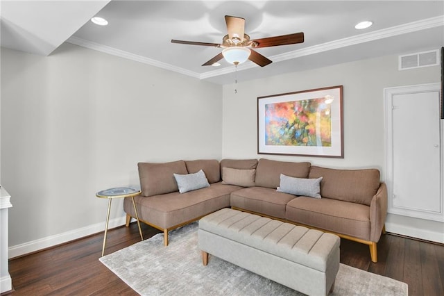 living room featuring dark hardwood / wood-style flooring, ornamental molding, and ceiling fan