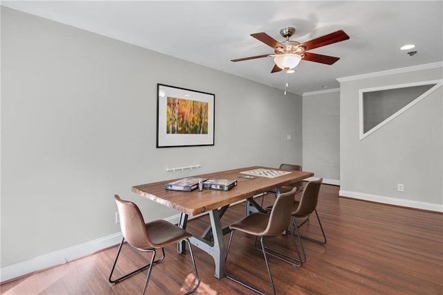 dining room with crown molding, wood-type flooring, and ceiling fan