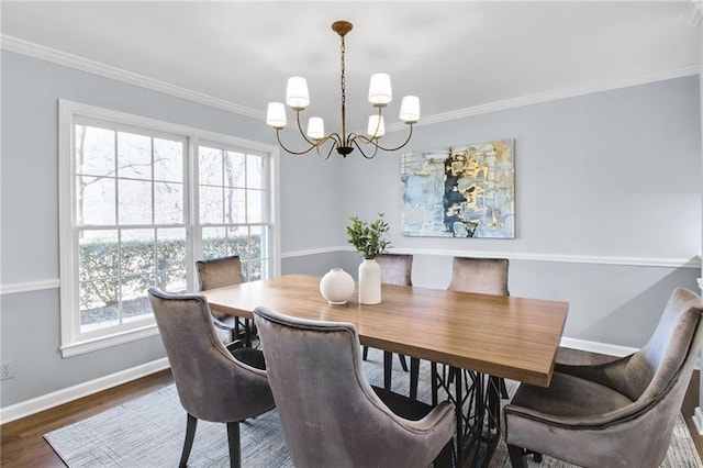 dining area featuring dark hardwood / wood-style flooring, ornamental molding, and a healthy amount of sunlight