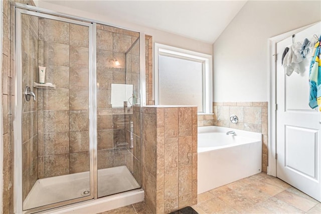 bathroom featuring plus walk in shower and lofted ceiling