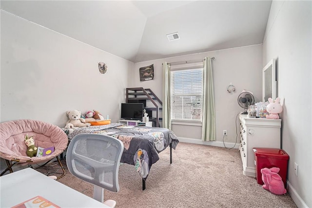 carpeted bedroom with vaulted ceiling