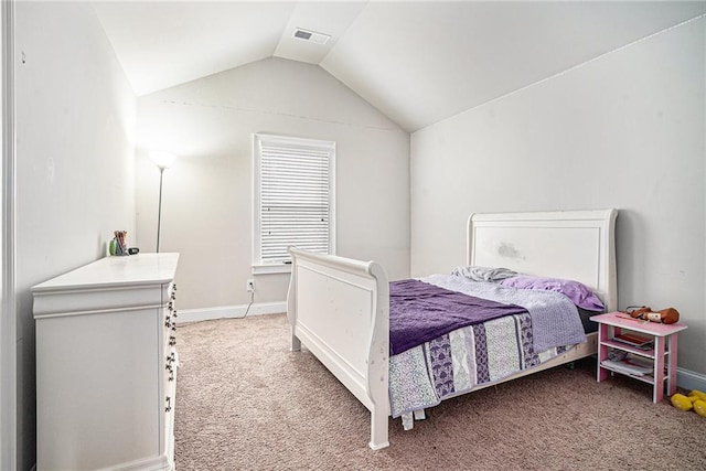 bedroom with lofted ceiling and carpet floors