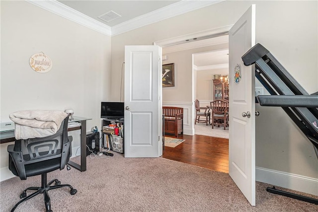 office featuring carpet, crown molding, and a notable chandelier