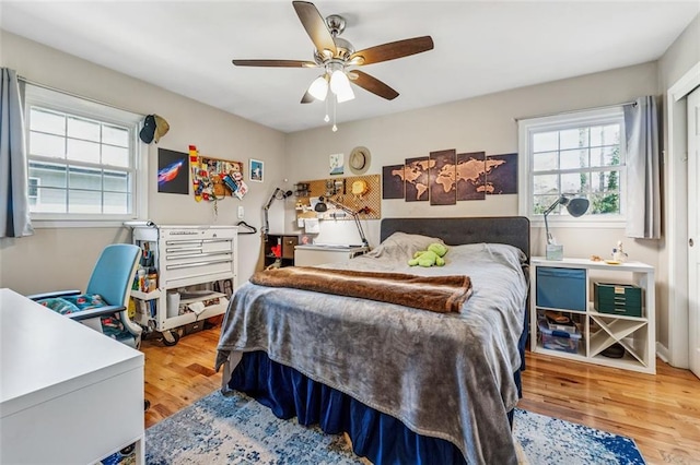 bedroom featuring a ceiling fan and wood finished floors