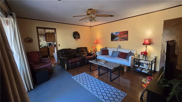 living room featuring crown molding, dark hardwood / wood-style floors, and ceiling fan