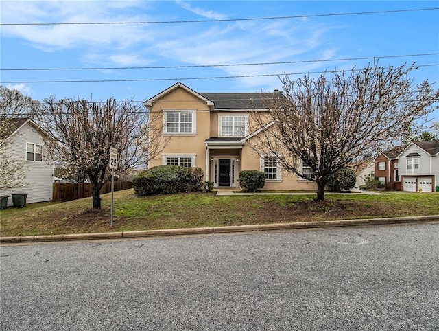 front of property with solar panels and a front yard