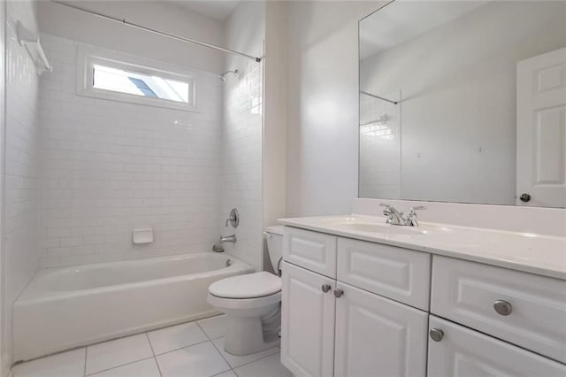 bathroom with toilet, vanity, tile patterned floors, and tub / shower combination