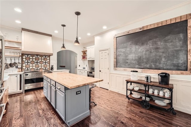 162 Taylor Ridge Way, Milton, GA 30004 - kitchen featuring open shelves, range with two ovens, gray cabinets, crown molding, and dark wood finished floors