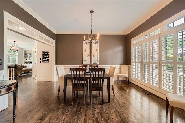 162 Taylor Ridge Way, Milton, GA 30004 - dining room featuring a chandelier, dark wood finished floors, crown molding, and a wainscoted wall