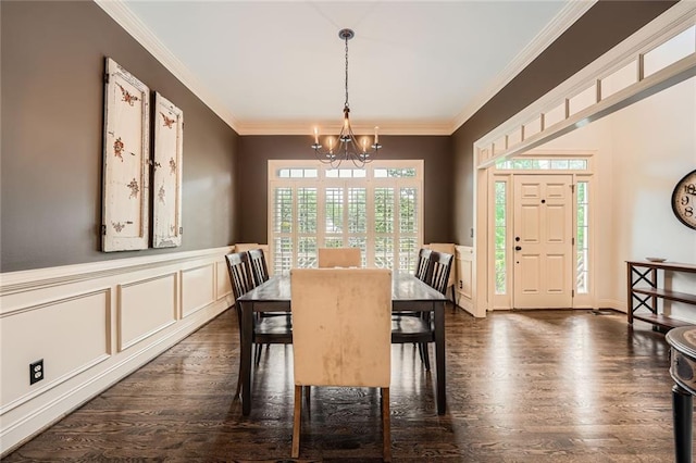 162 Taylor Ridge Way, Milton, GA 30004 - dining space featuring a chandelier, dark wood-type flooring, ornamental molding, wainscoting, and a decorative wall