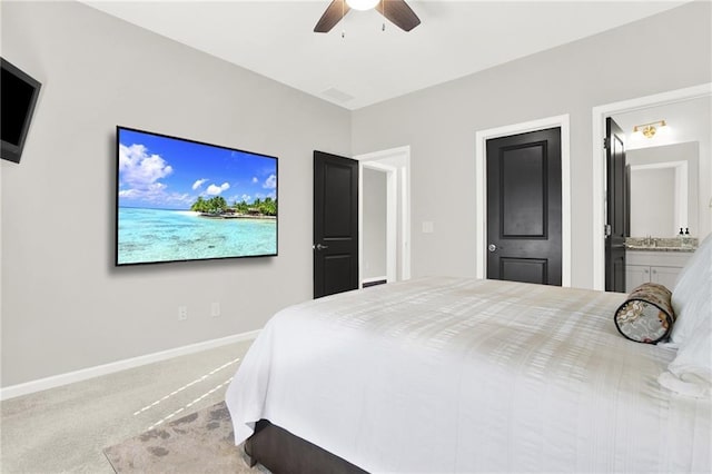 bedroom featuring carpet flooring, ceiling fan, and ensuite bath