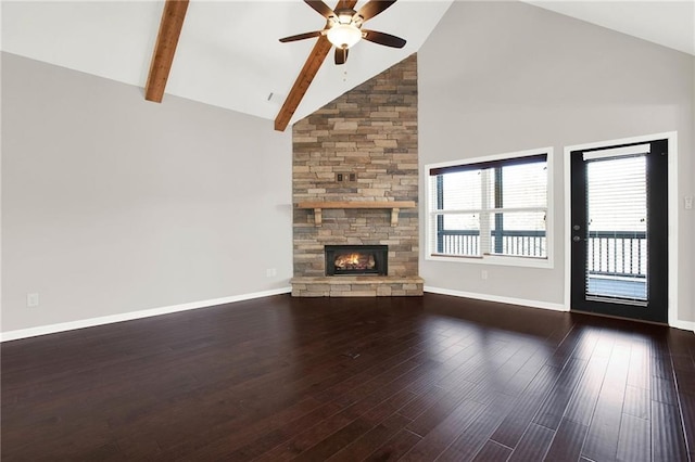 unfurnished living room with ceiling fan, hardwood / wood-style floors, high vaulted ceiling, a fireplace, and beamed ceiling