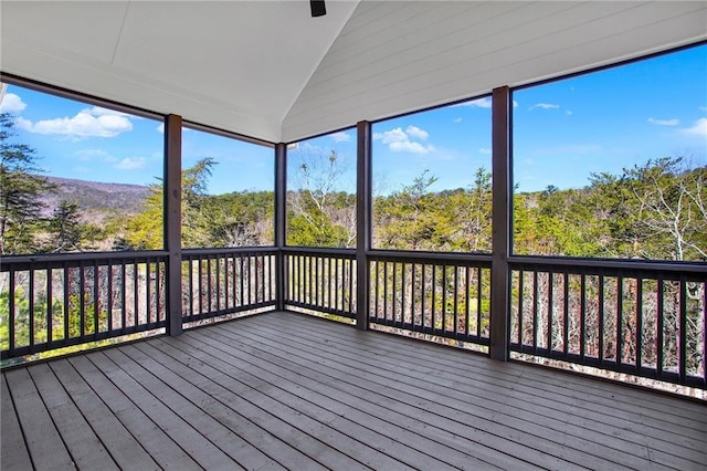 unfurnished sunroom with lofted ceiling