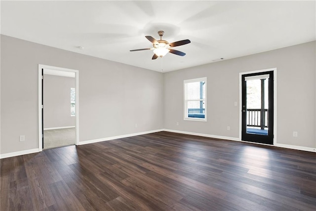 spare room featuring ceiling fan and dark hardwood / wood-style floors